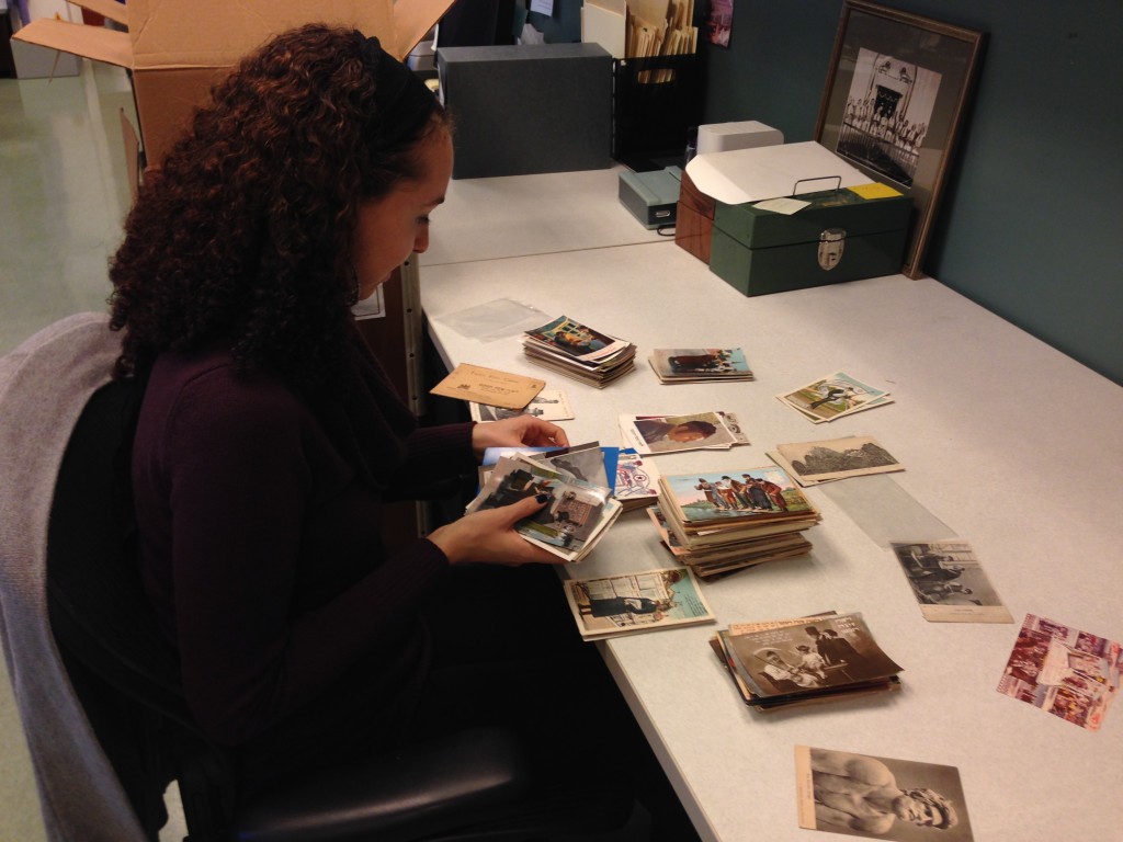 Processing Archivist Amy Lazarus organizing Rosh Hashanah postcards.
